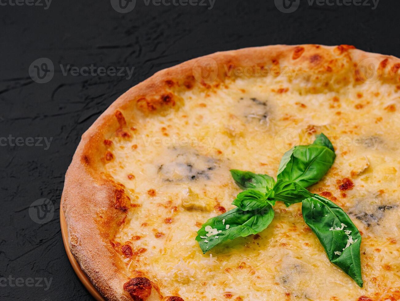 fresh tasty four cheeses pizza on wood photo