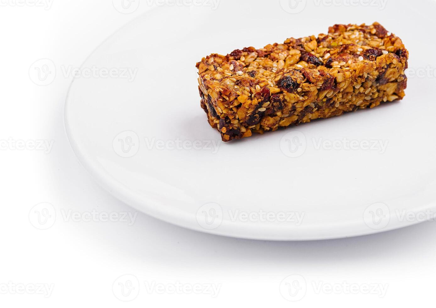 granola bar on white plate isolated on white background photo