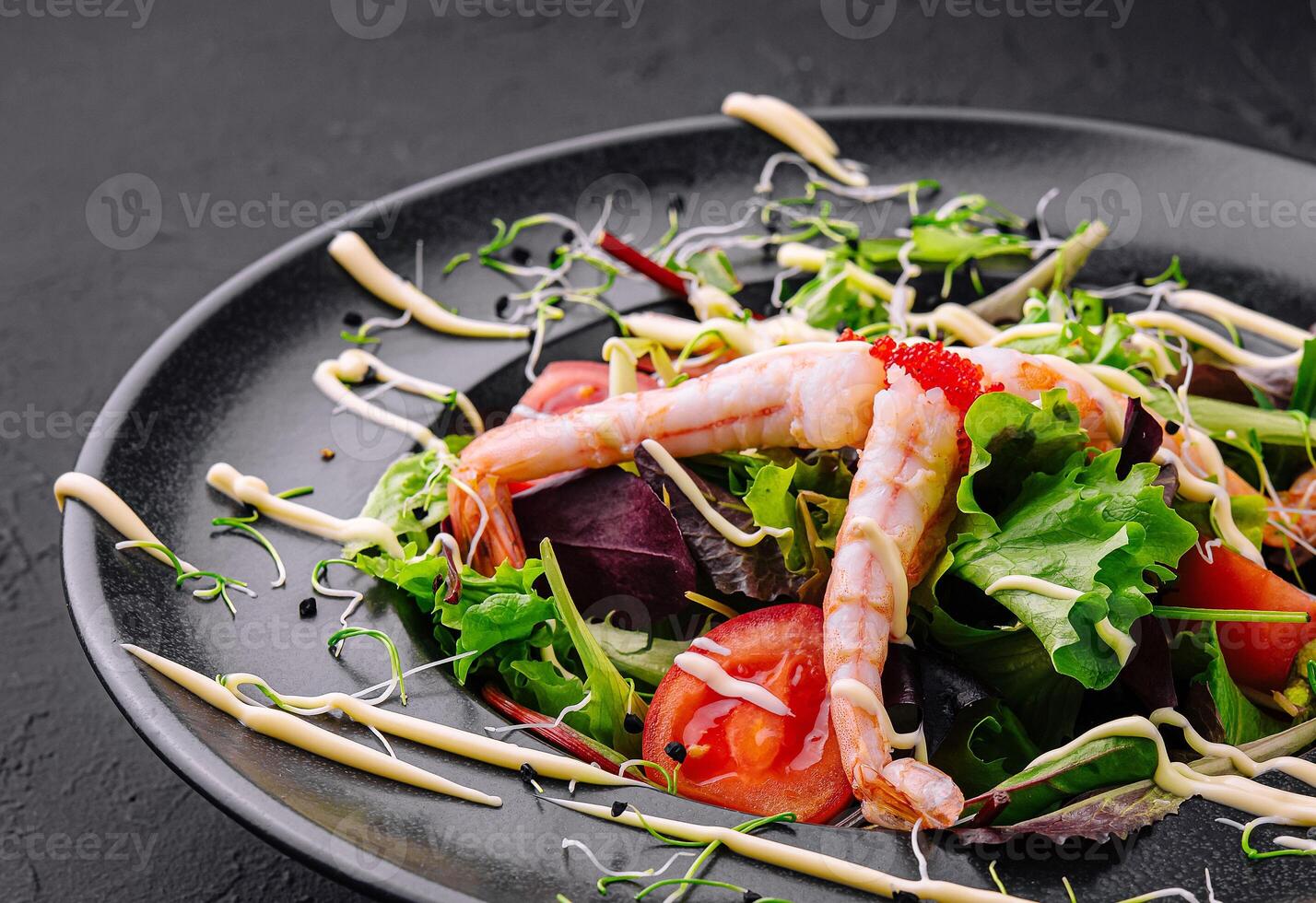 Healthy salad with shrimps close up photo