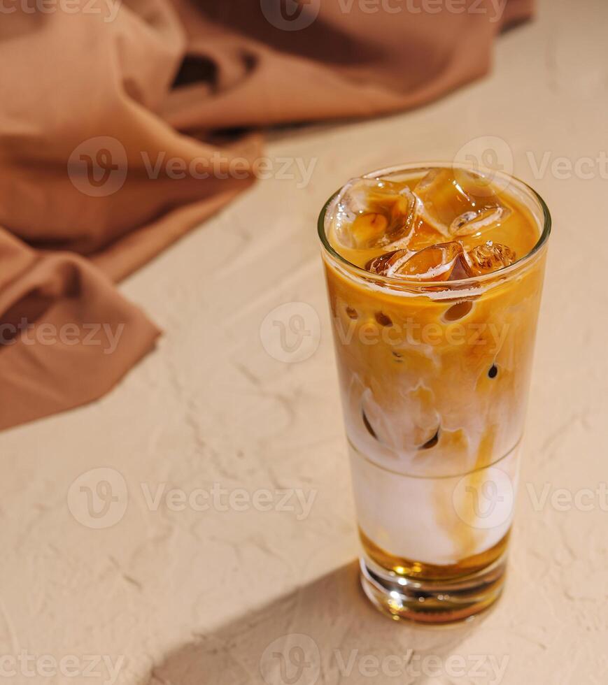 Iced coffee with ice cubes top view photo