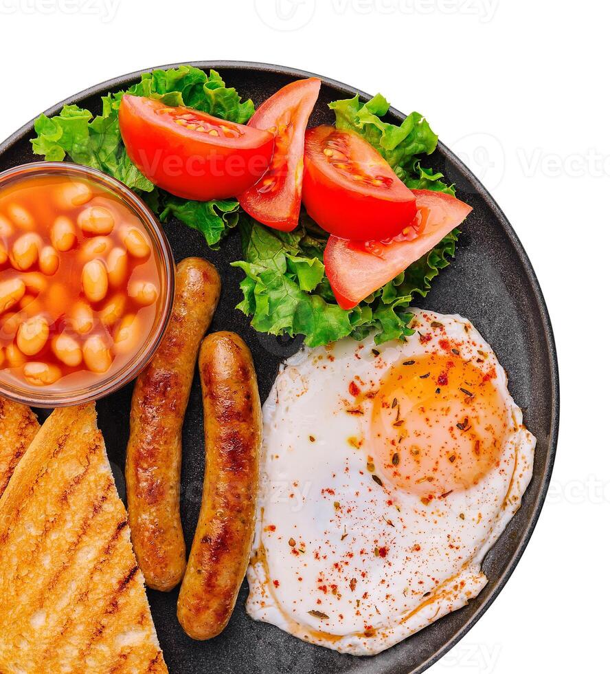 english breakfast on black pan top view photo