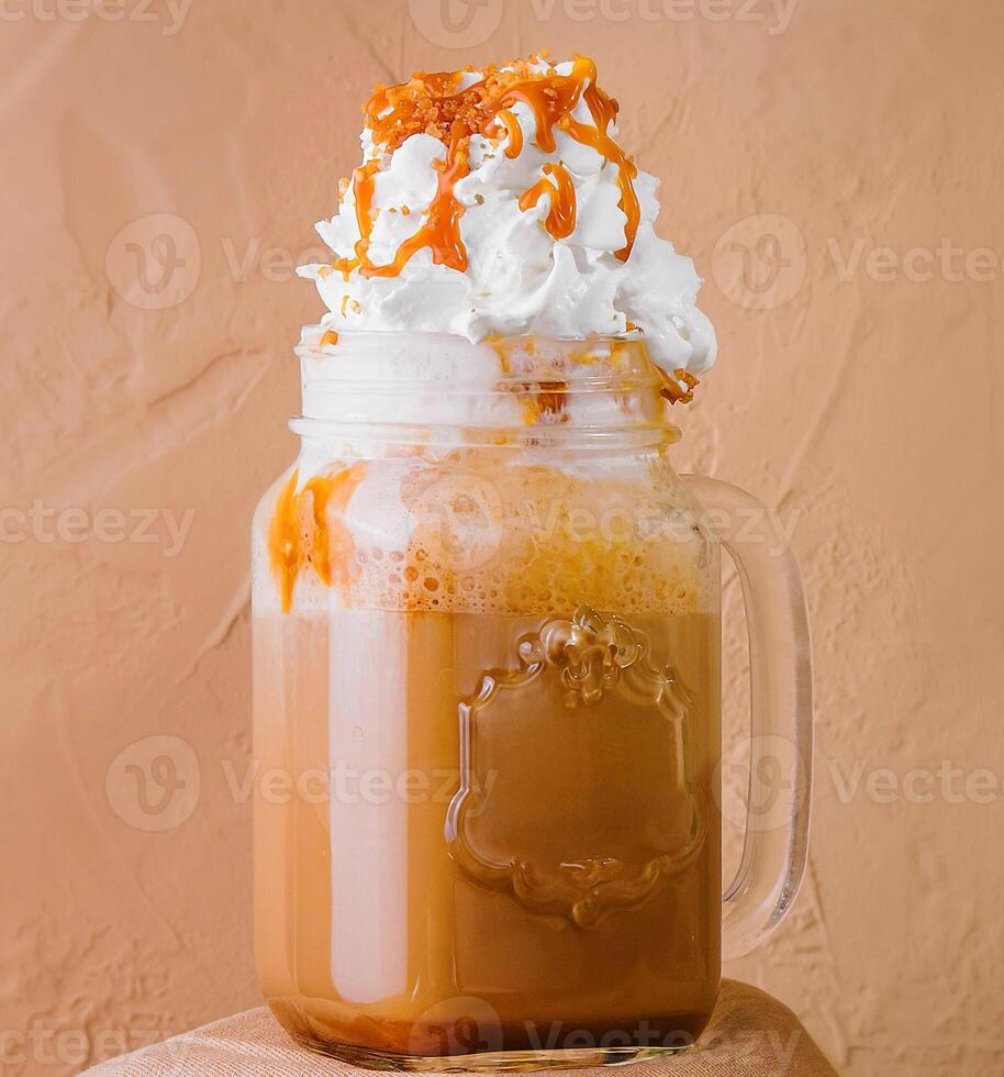 Caramel iced latte with whipped cream photo