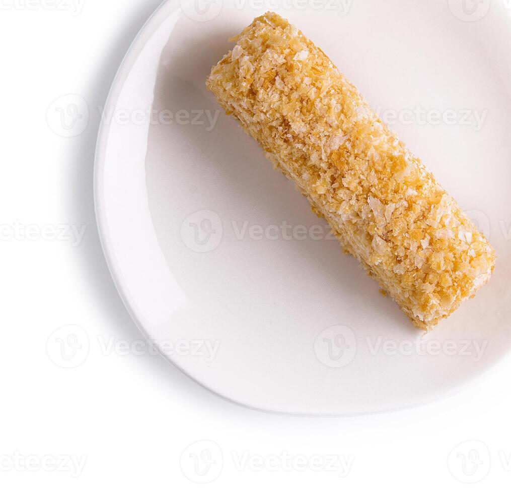 Napoleon Cake on a white plate isolated photo