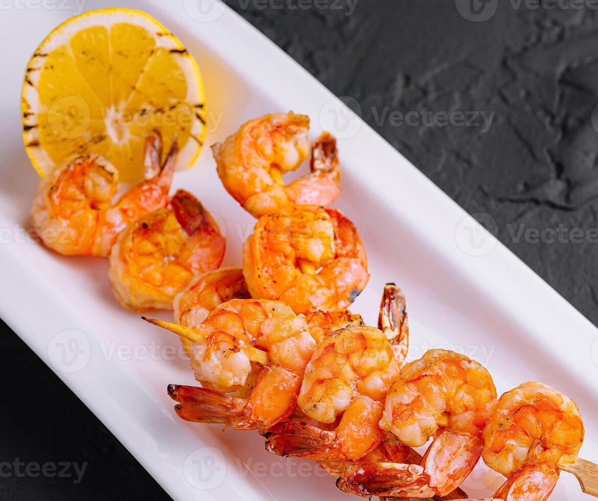 Grilled Shrimp Scampi Skewers with lemon photo