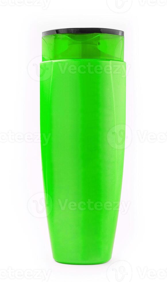 green plastic bottle with shampoo gel on white background photo