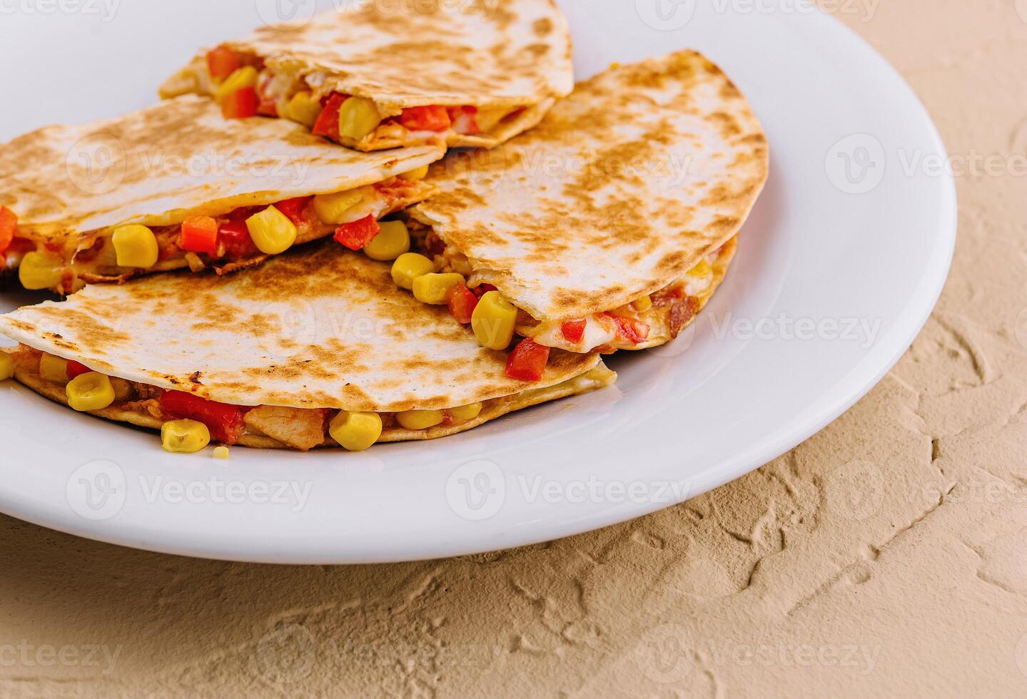 Mexican quesadilla with vegetables on plate photo