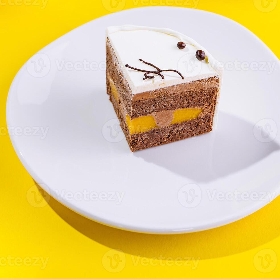 top view of a cream cake on white plate photo