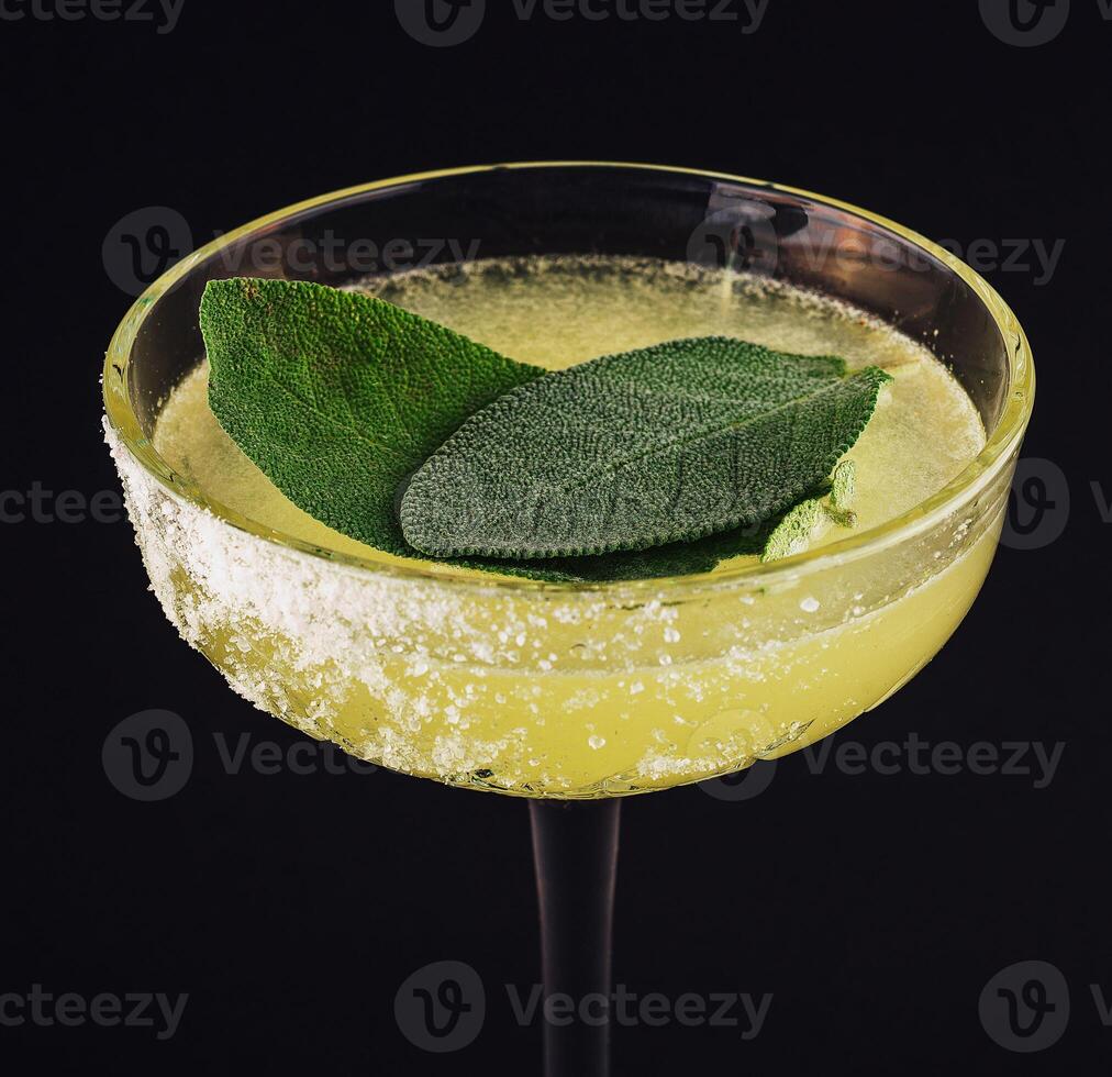 Classic margarita cocktail with mint leaves photo
