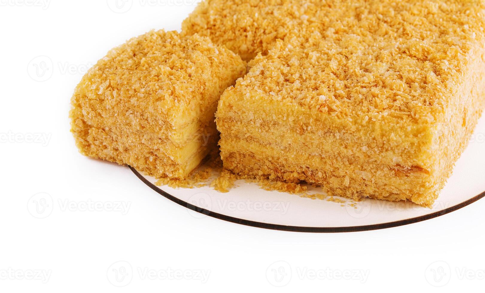 Napoleon Cake on a white plate isolated photo