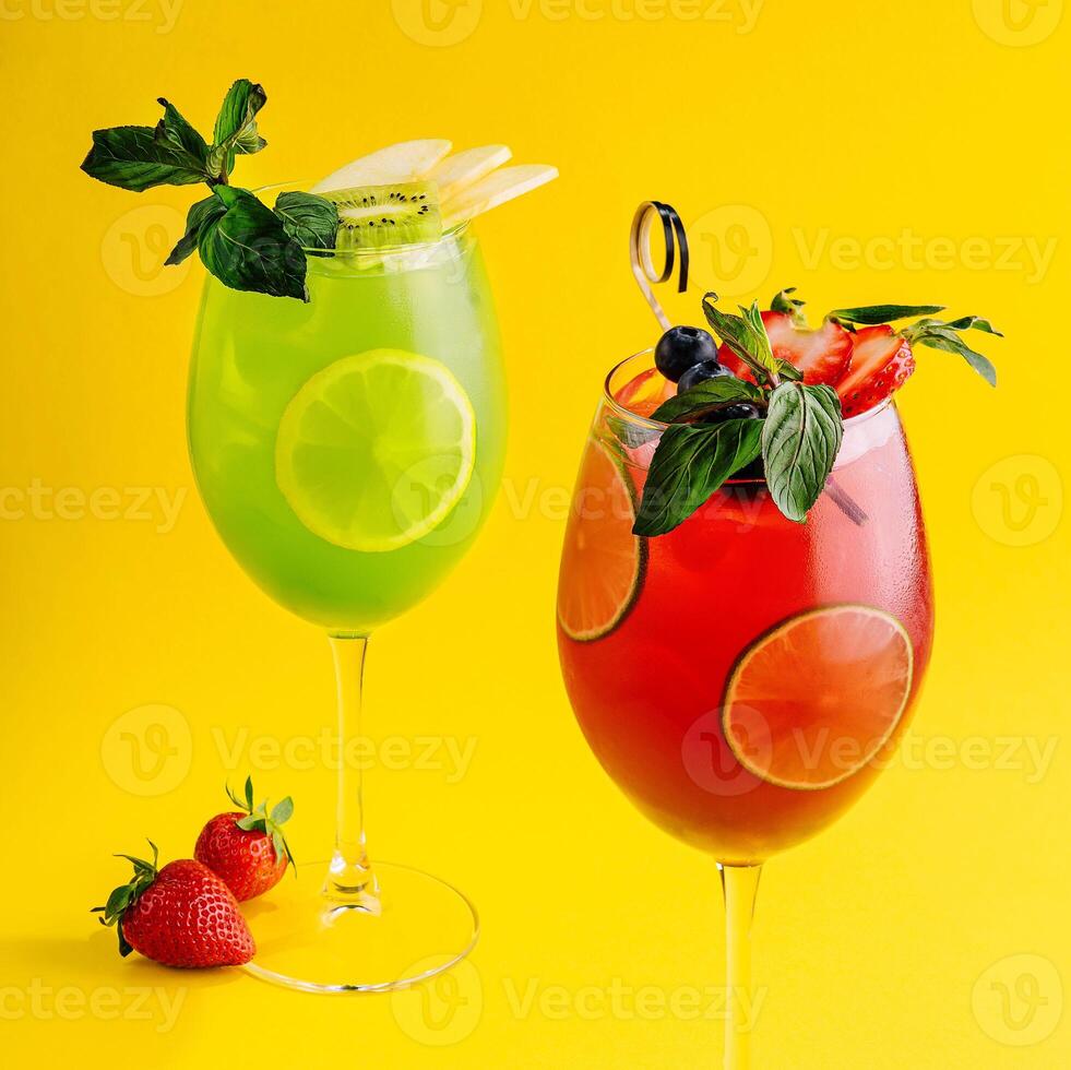 Cocktails with fresh strawberries, kiwi and lemons photo