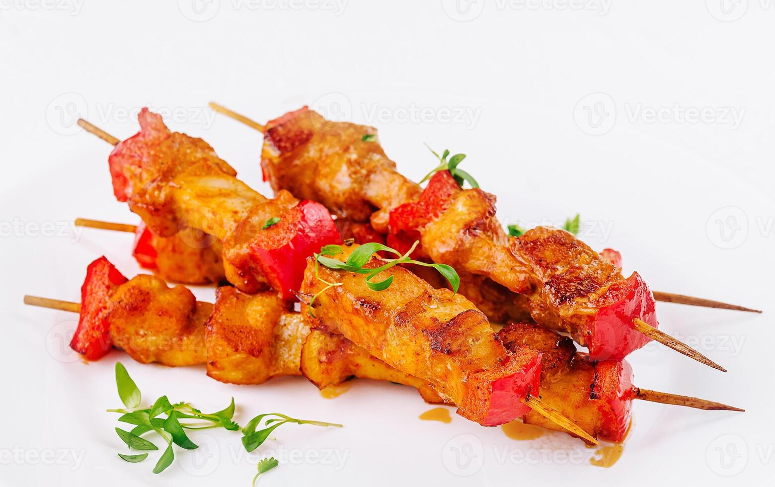 Chicken skewers with slices of sweet peppers photo