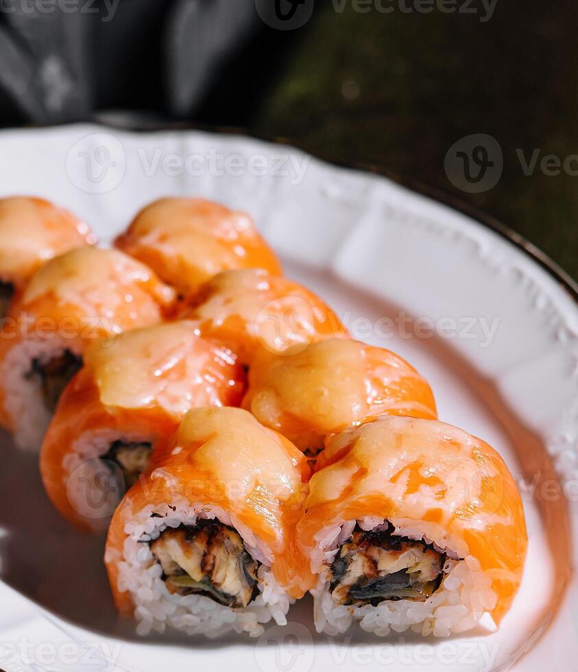 Salmon Fried sushi roll with eel and cheese photo