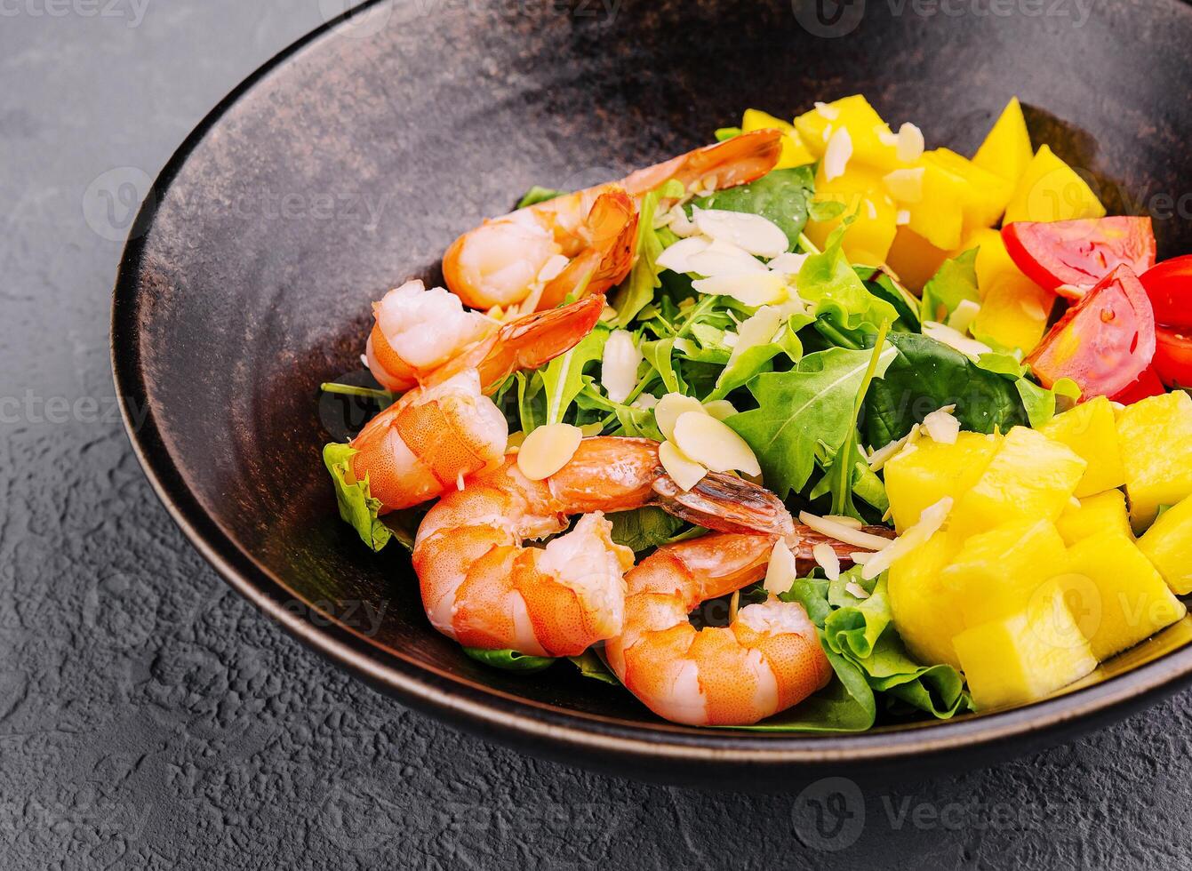 Seafood salad in ceramic bowl top view photo