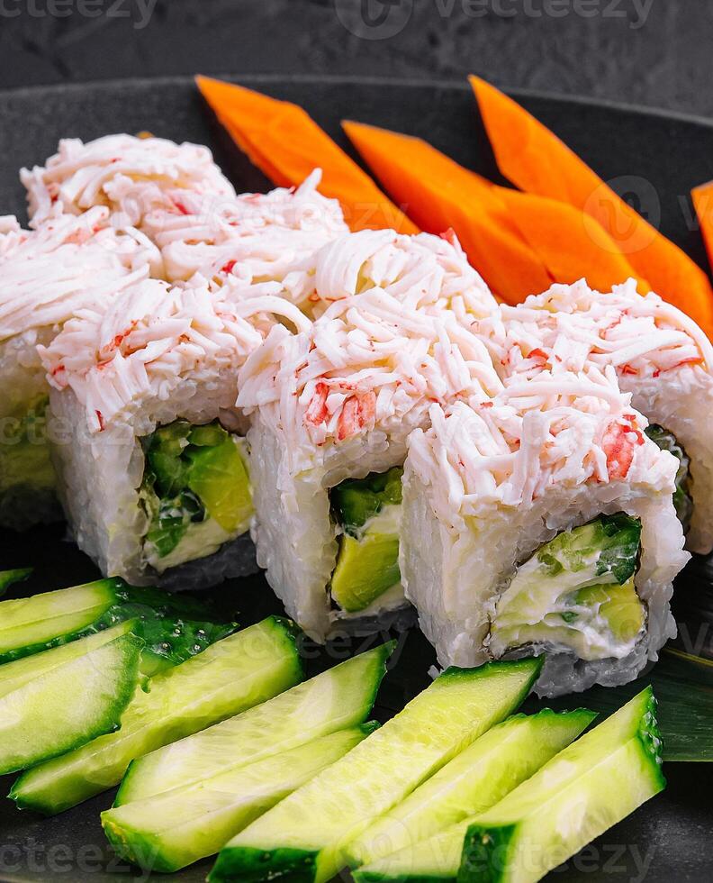 sushi rolls with crab sticks and cucumbers photo
