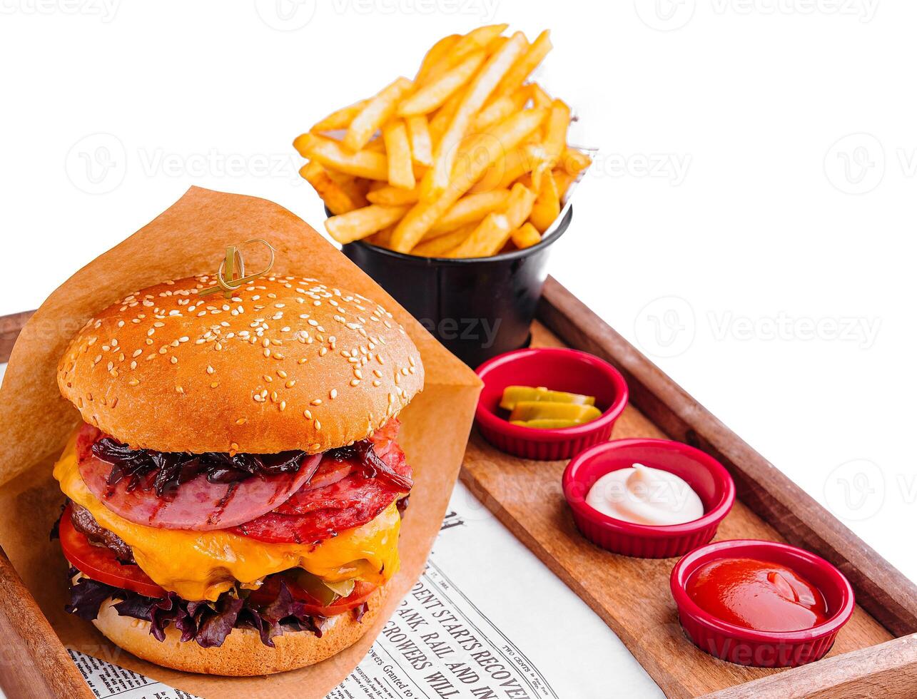burger with different types of sausages and fries photo