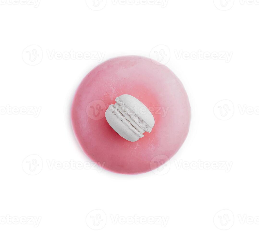 Pink mousse cake decorated with white macaroon photo