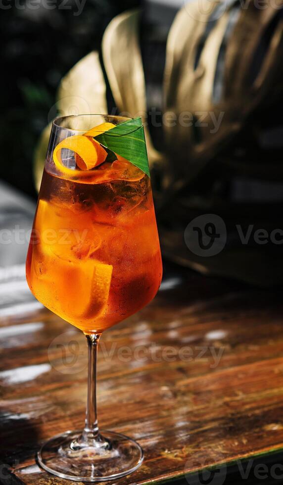 Glass of Aperol Spritz cocktail on the table photo