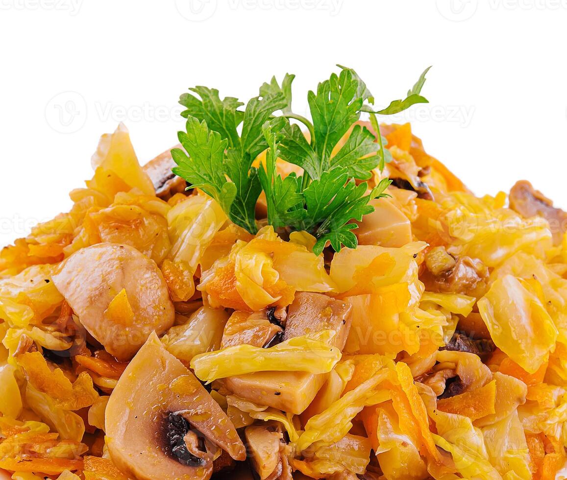 Fried cabbage with mushrooms on white plate photo