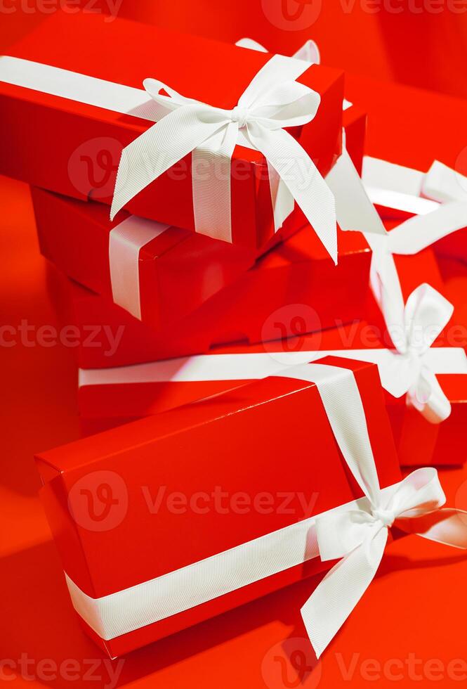 Red gifts on a yellow background photo