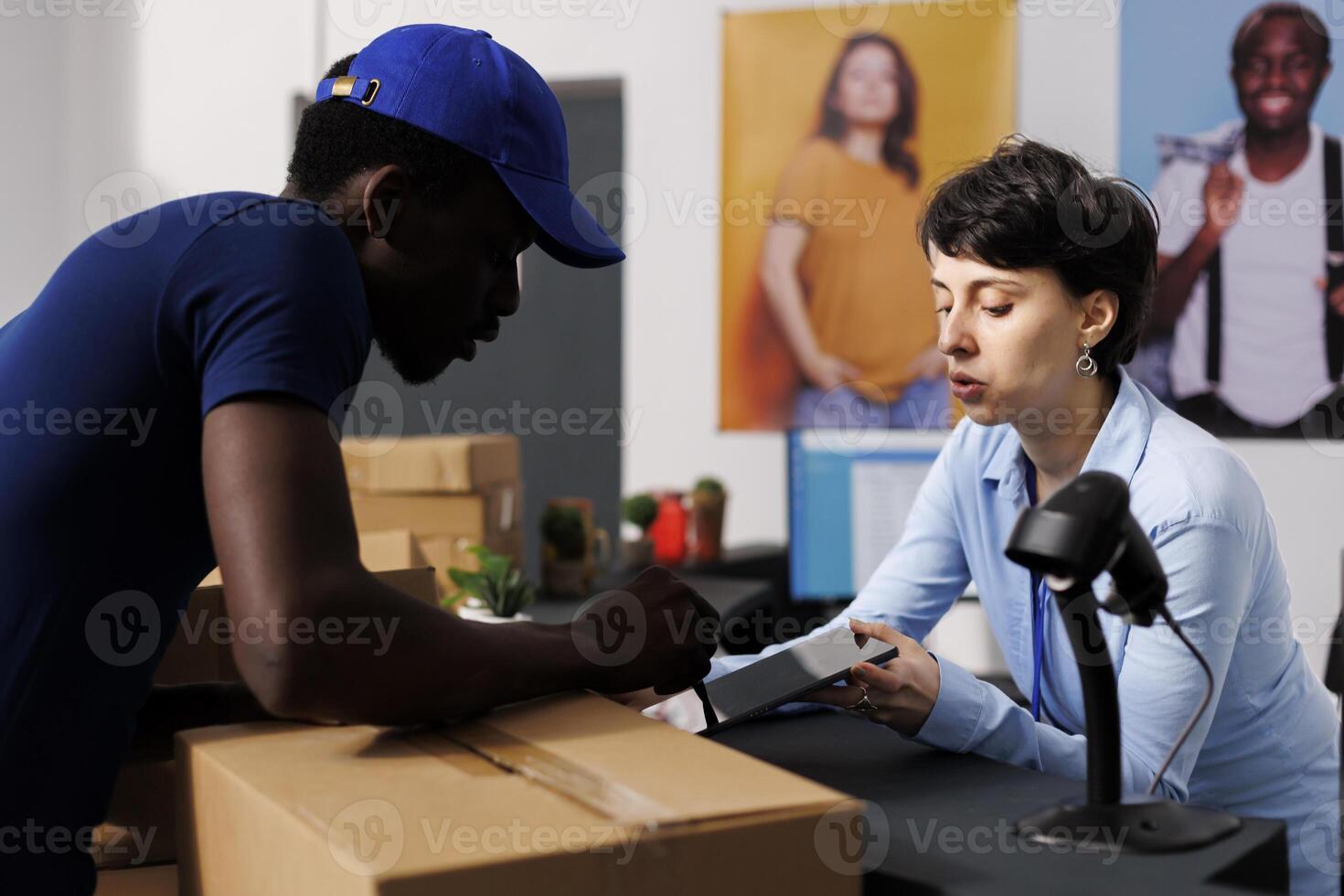 Caucasian manager signing logistics files, discussing delivery details with courier in clothing store. African american deliveryman preparing to ship customers online orders in modern boutique photo