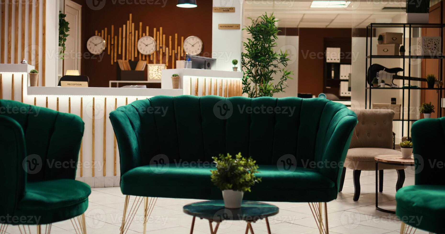 Crane down shot of welcoming rustic hospitality industry lobby interior filled with plants, waiting for guests. Empty cozy stylish hotel check in reception desk ready for arriving tourists photo