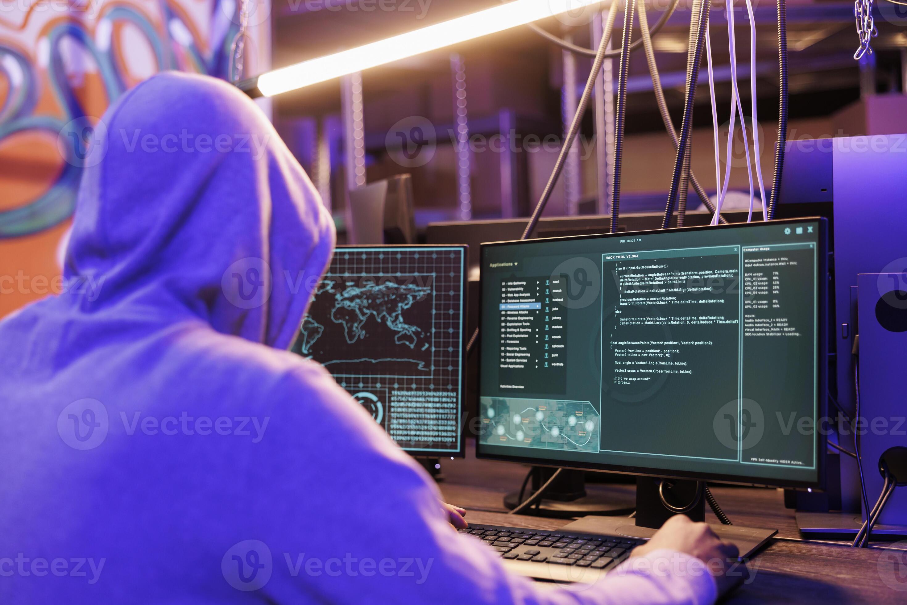 Criminal launching malicious software on computer screen for phishing ...