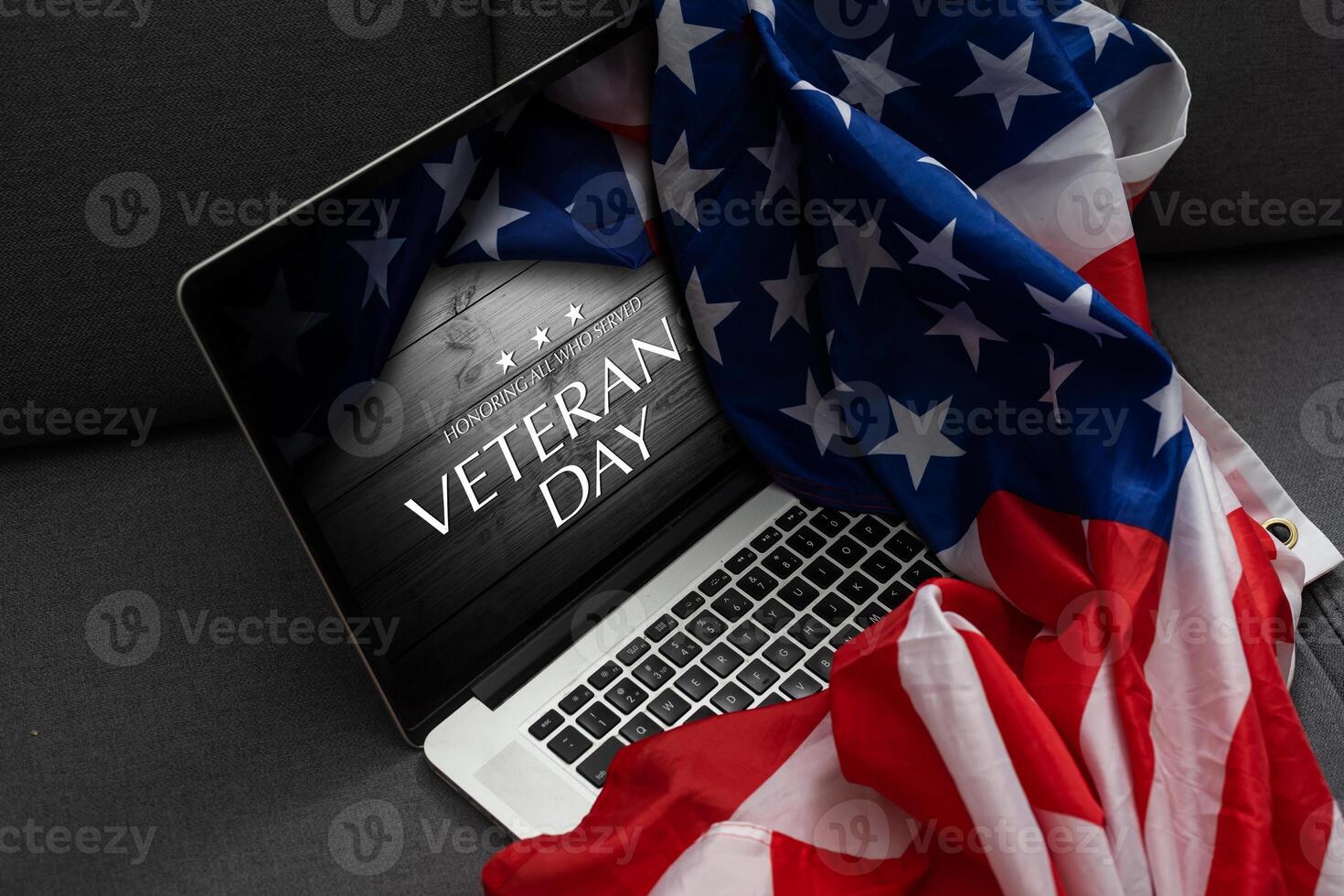 laptop with usa flag and inscription veterans day photo