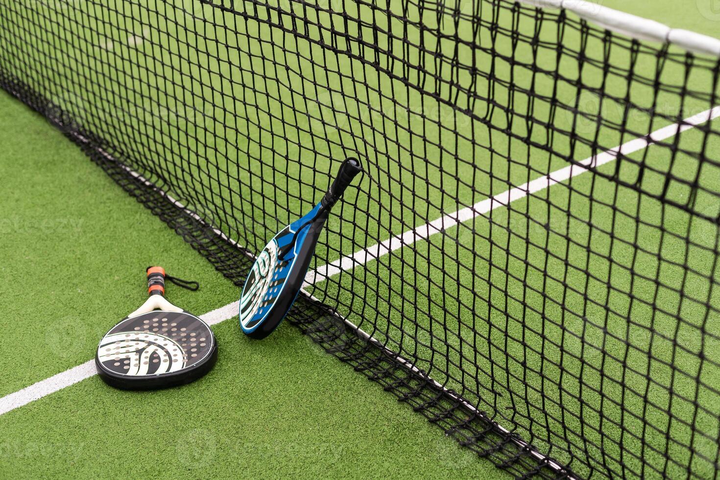 paddle sport on the paddle court, ball, rackets photo