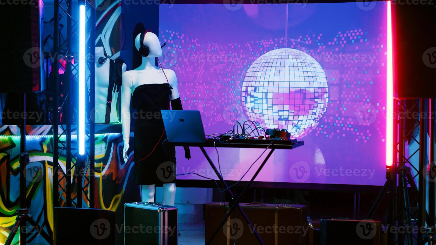 Empty sound stage with DJ panel used for live music show at nightclub, audio mixing station. Dance floor with spotlights and disco ball at discotheque, clubbing and partying concept. photo