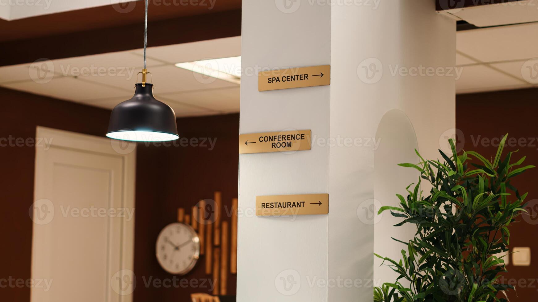 Empty stylish business accommodation lobby interior with deluxe spa center, conference room, and restaurant amenities. Close up of hotel facilities plaque signs on resort foyer wall photo