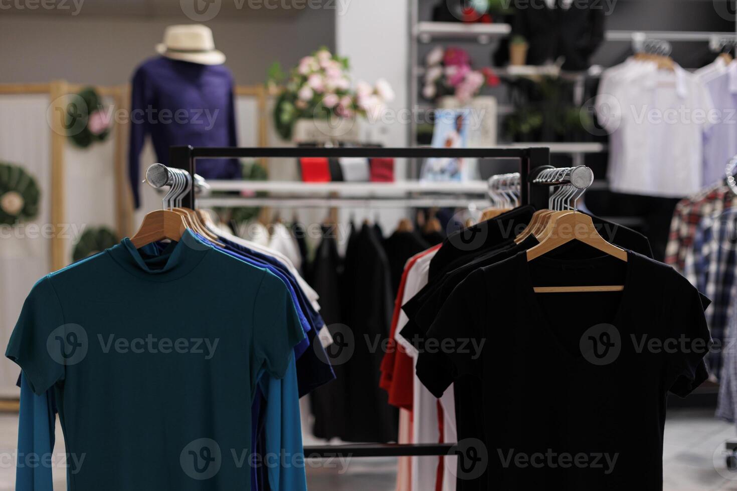 Modern boutique with colorful t-shirt and stylish accessories. Empty clothing store filled with new fashion collection and fashionable clothes waiting for customers to come and shop photo