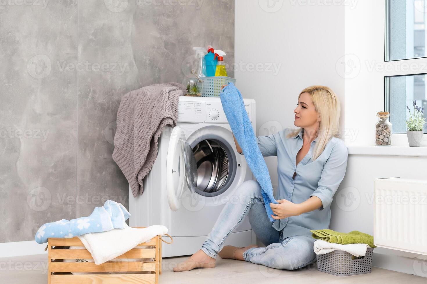 Housework, young woman doing laundry photo