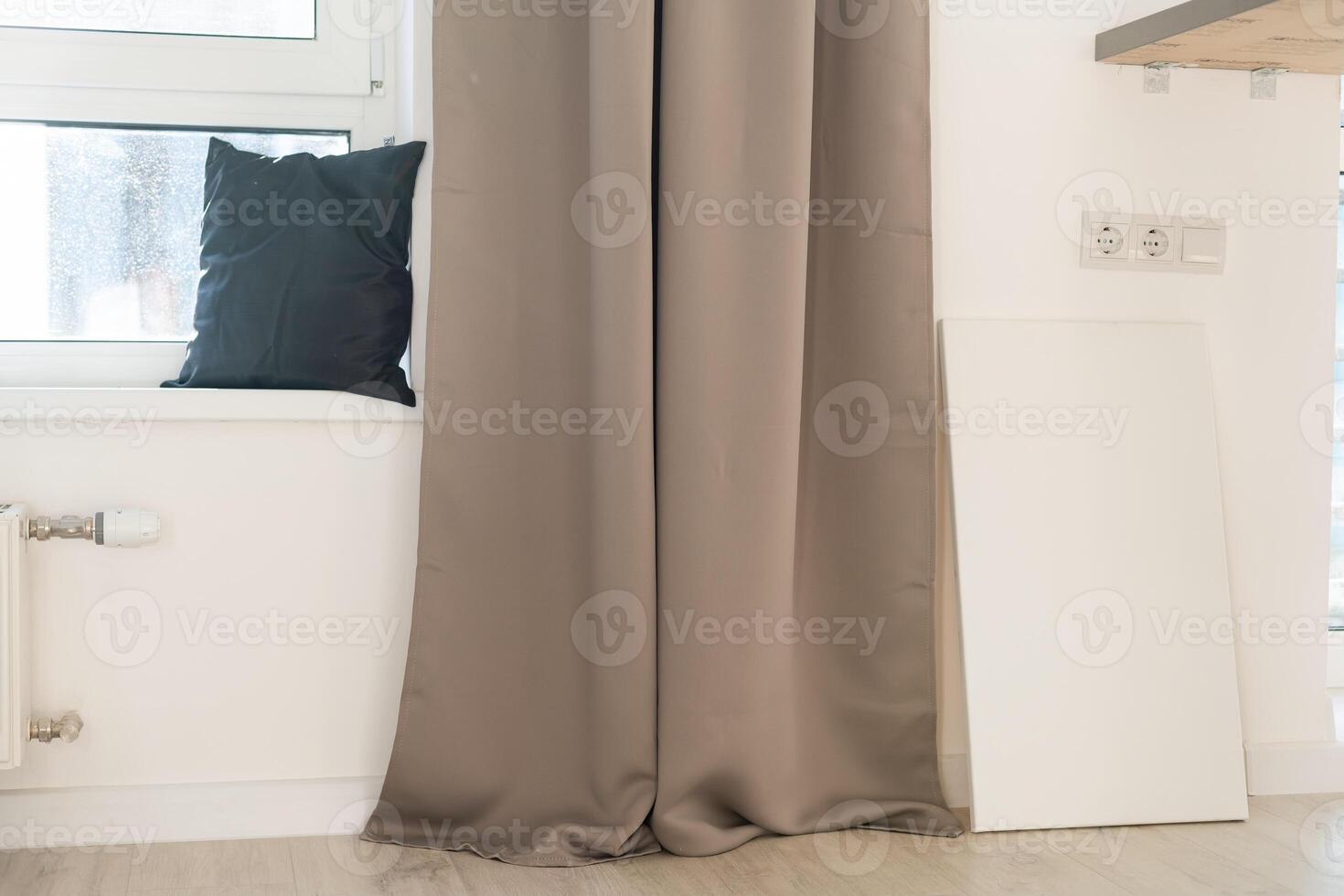 Blank white poster banner standing in the apartment. Mock up template for present business concept. photo