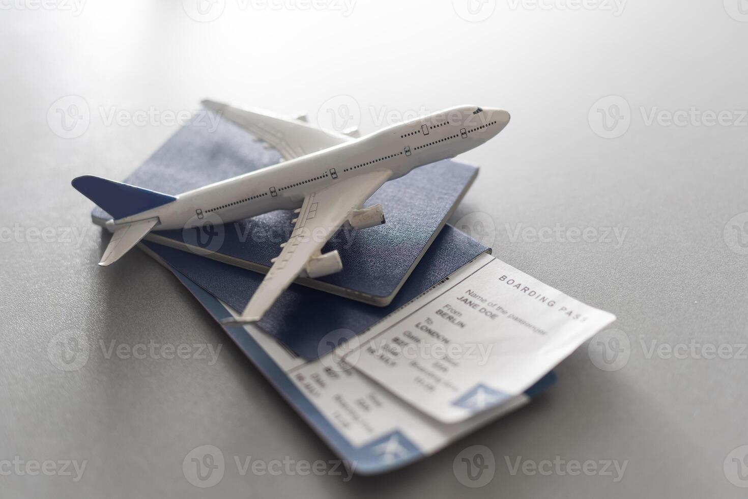 Preparation for Traveling concept, toy airplane, passport with copy space photo