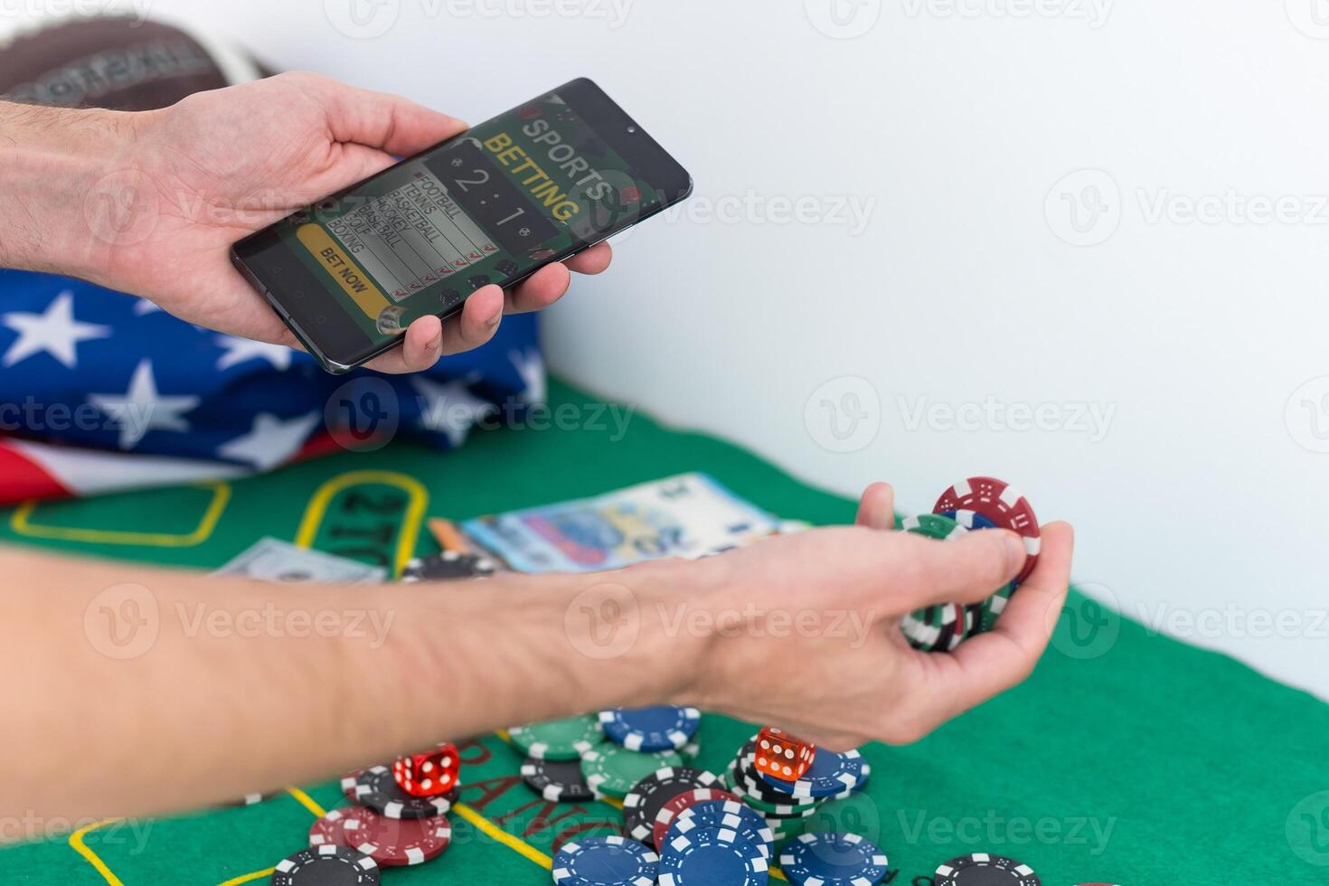 Smartphone with gambling mobile application, ball and money banknotes. Sport and betting concept photo