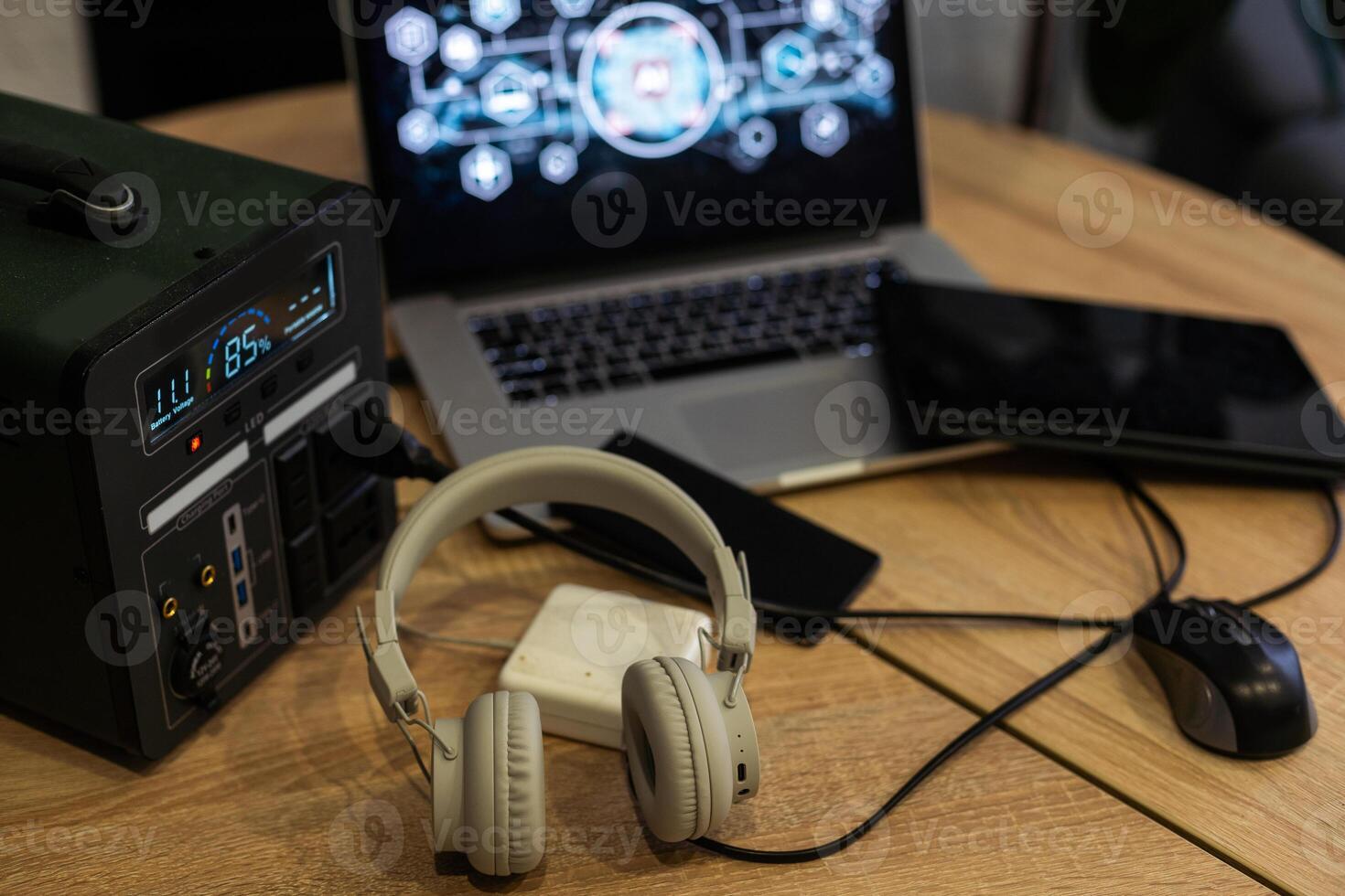 Portable power station charging devices on table in living room photo