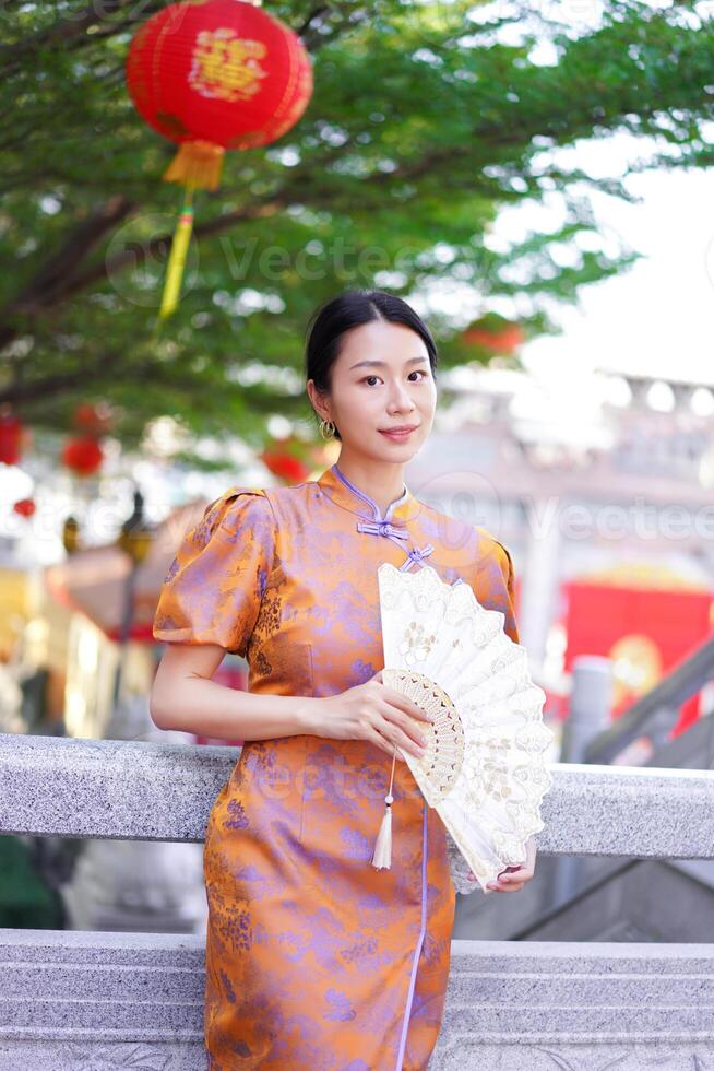 Chinese woman in traditional costume for Happy chinese new year concept photo