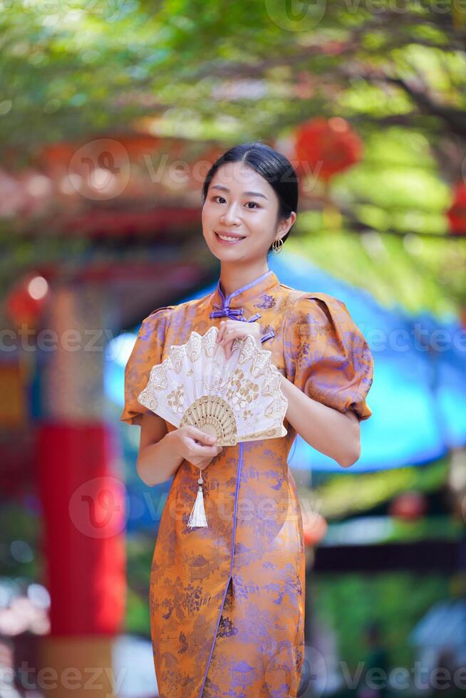 Chinese woman in traditional costume for Happy chinese new year concept photo