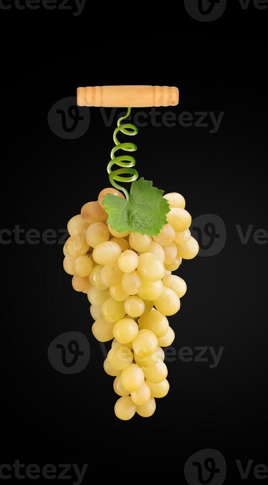 a bunch of grapes hanging from a wooden hook photo