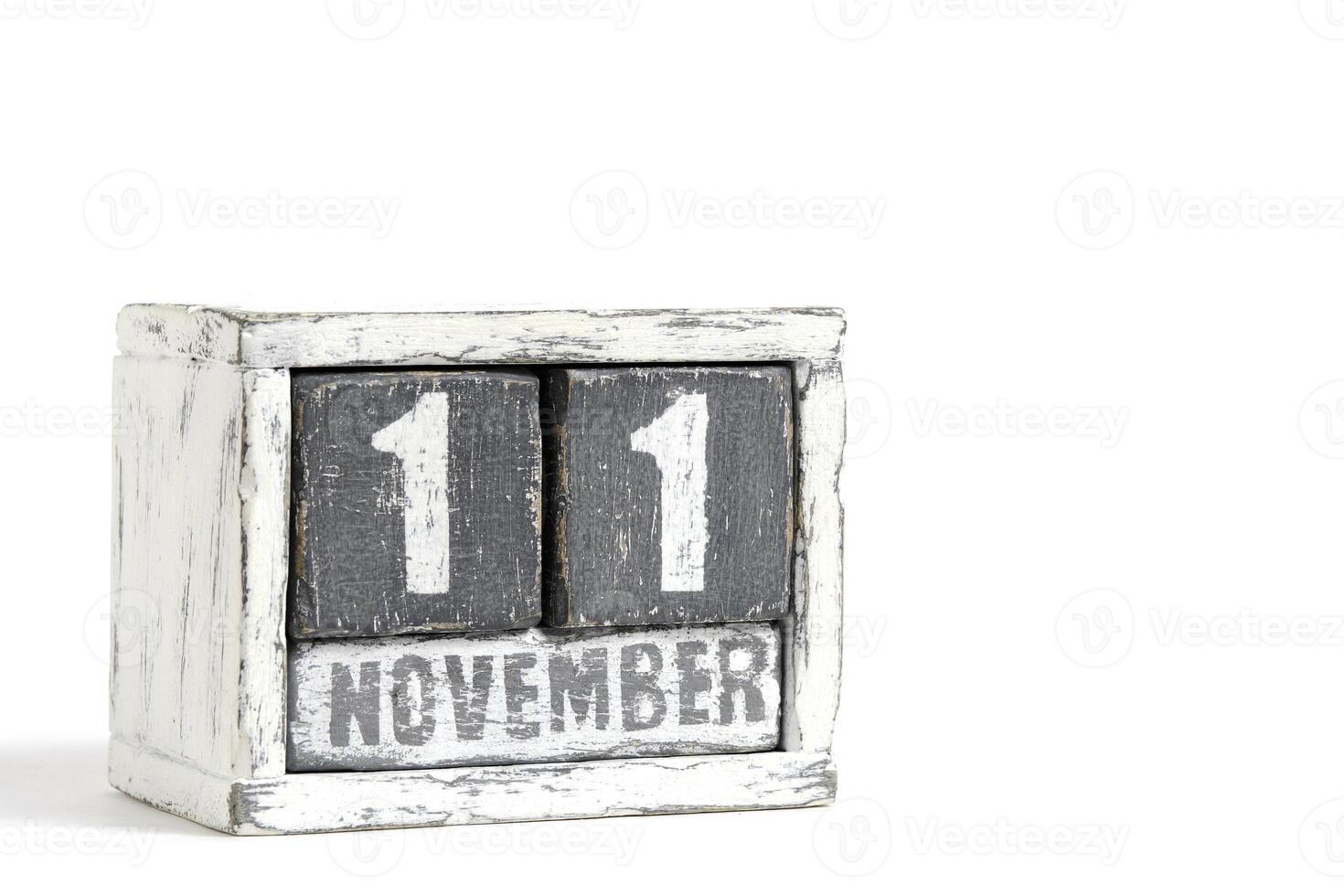 November 11 on wooden calendar, on white background. photo