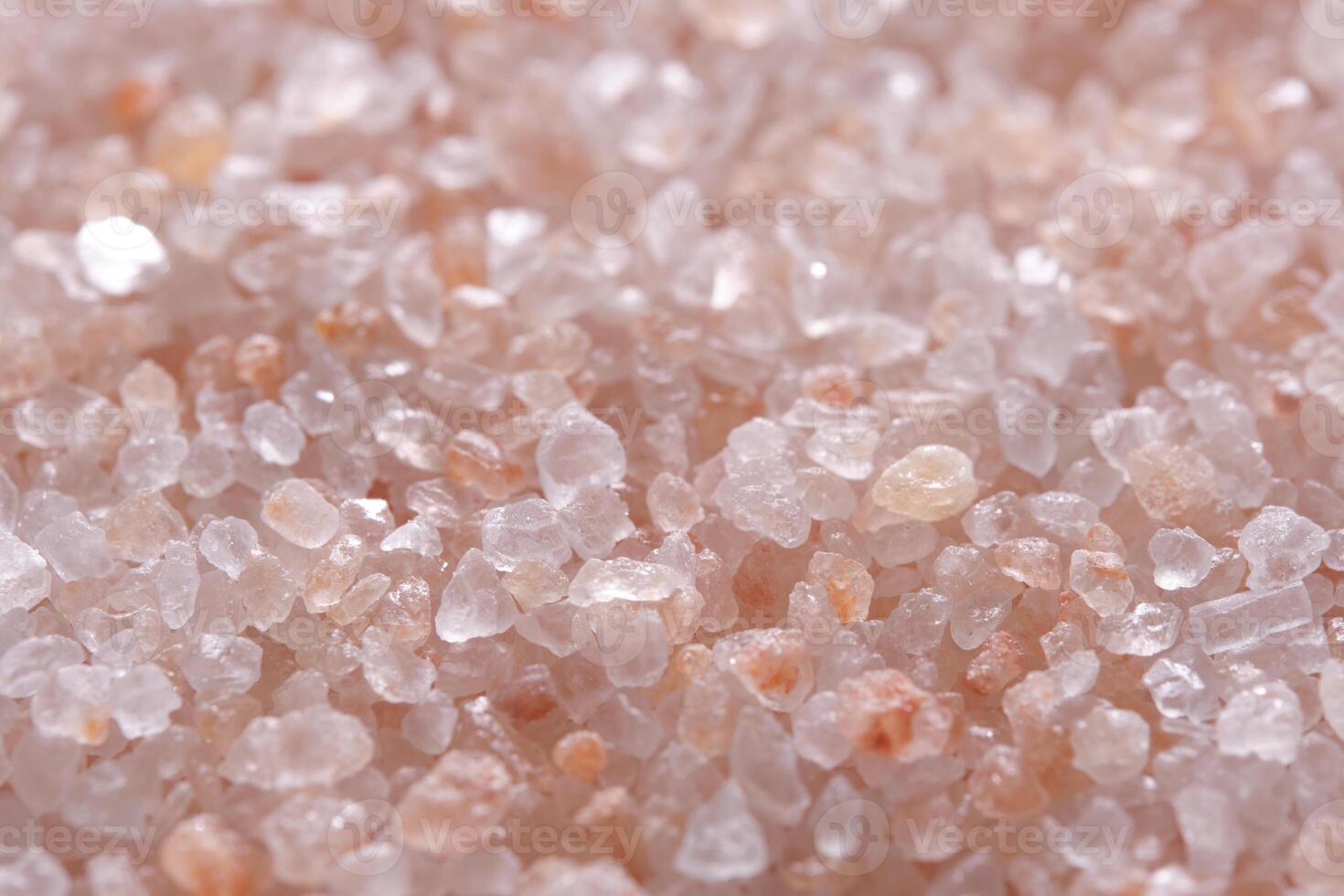 Background, pink edible Himalayan salt closeup. photo