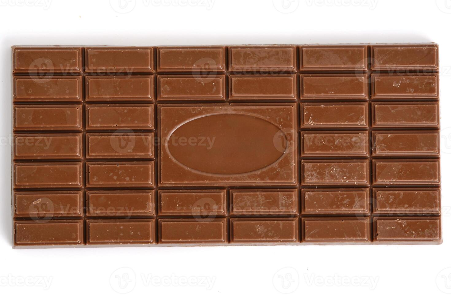 Bar of milk chocolate white background. photo