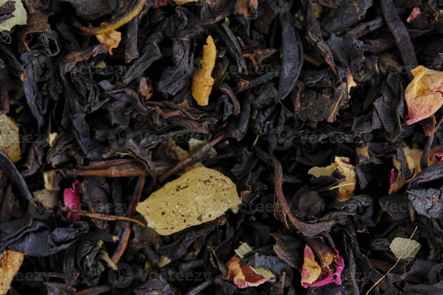 Black and green leaf tea with fruits and berries. photo