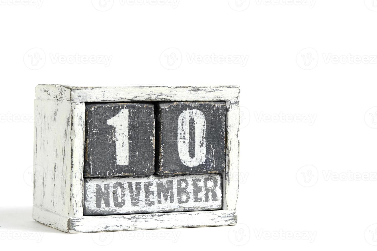November 10 on wooden calendar, on white background. photo