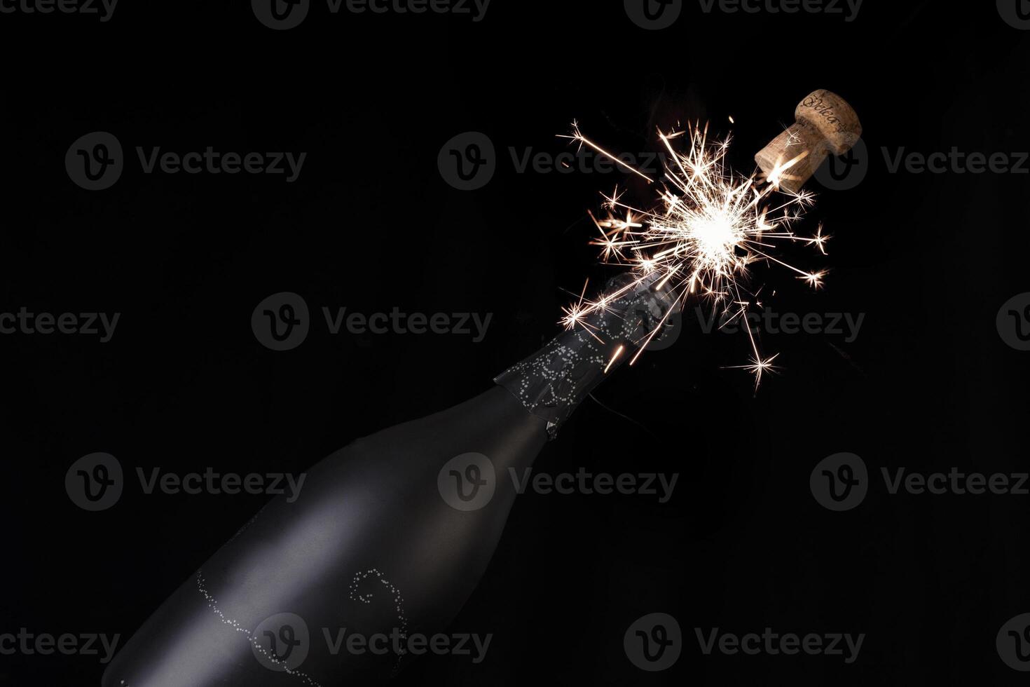 champagne bottle with fireworks photo