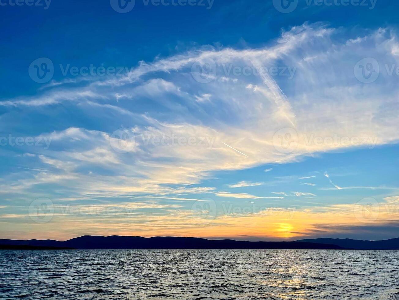 sunset over the ocean photo