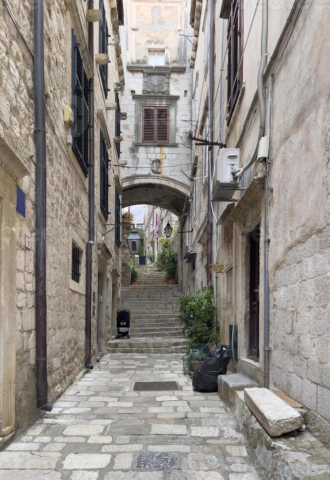 a narrow stone alleyway photo