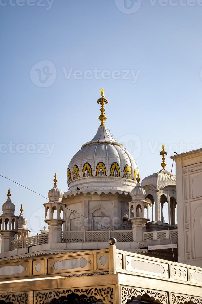 View of details of architecture inside Golden Temple - Harmandir Sahib in Amritsar, Punjab, India, Famous indian sikh landmark, Golden Temple, the main sanctuary of Sikhs in Amritsar, India photo