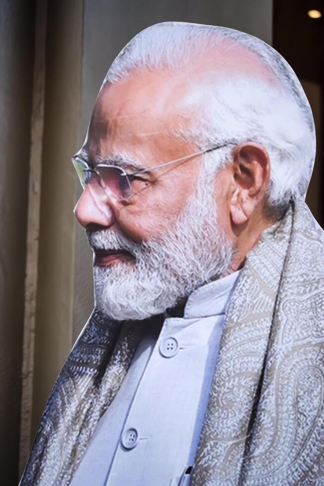 New Delhi, India - February 17 2024 - Prime Minister Narendra Modi cut out during BJP road show, the statue of PM Modi while attending a big election rally in the capital photo
