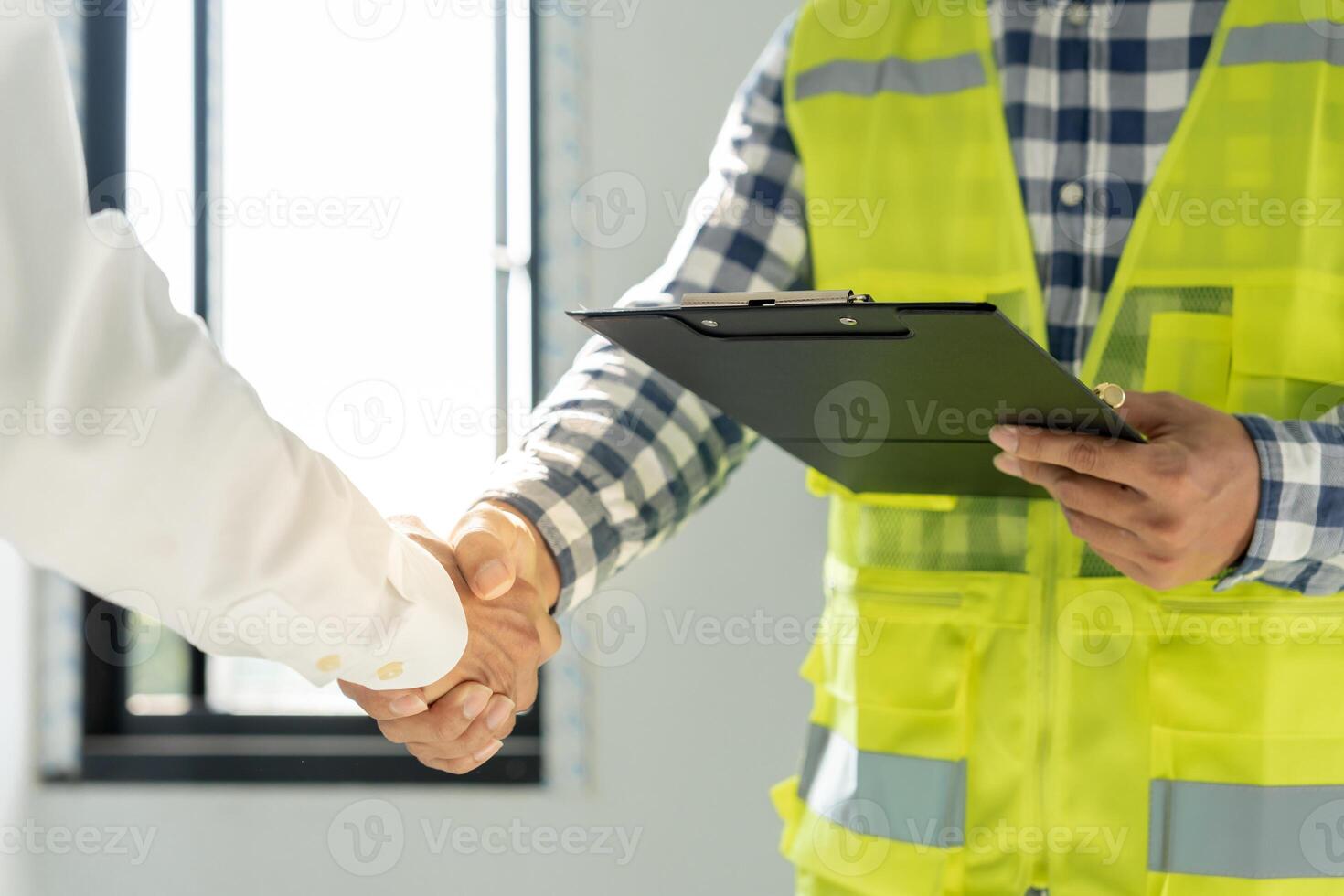 Construction team hands shaking greeting start up plan new project contract in office center at construction site, industry ,architecture, partner, teamwork, agreement, property, contacts. photo